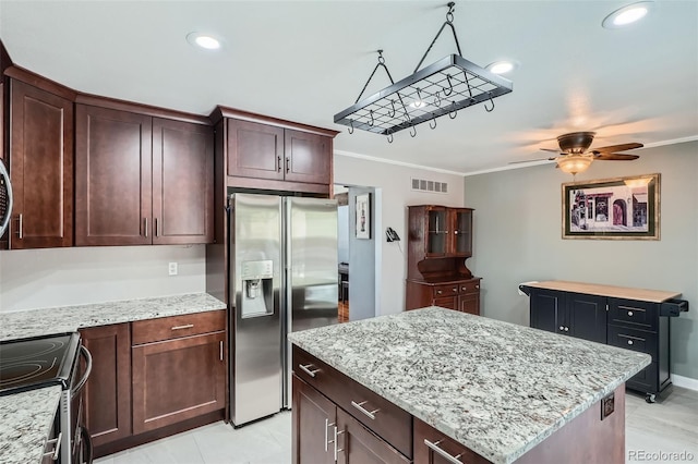 8101 S San Juan Range Rd, Littleton, CO 80127 - kitchen with appliances with stainless steel finishes, crown molding, ceiling fan, a kitchen island, and light stone countertops