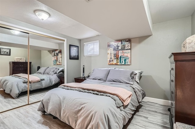 8101 S San Juan Range Rd, Littleton, CO 80127 - bedroom with wood finished floors, baseboards, and a closet
