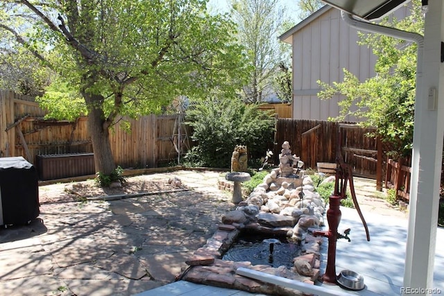 8101 S San Juan Range Rd, Littleton, CO 80127 - fenced backyard with a patio