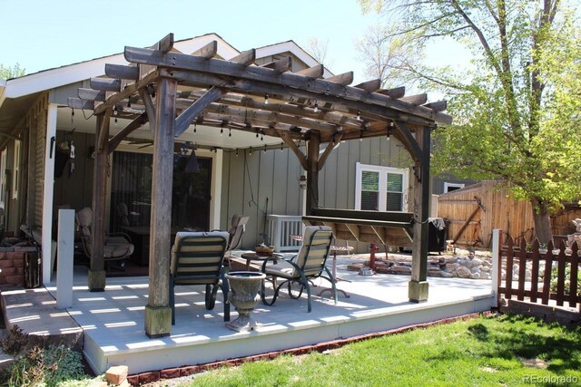8101 S San Juan Range Rd, Littleton, CO 80127 - view of patio / terrace with a wooden deck and a pergola