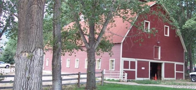 8101 S San Juan Range Rd, Littleton, CO 80127 - view of front facade with a barn and an outbuilding