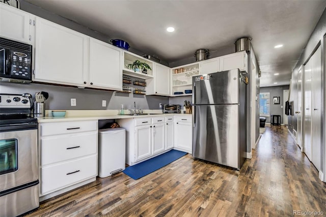 kitchen featuring white cabinets, open shelves, appliances with stainless steel finishes, and light countertops