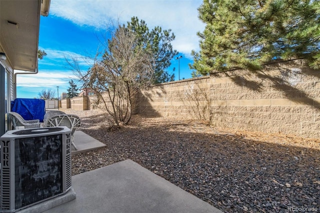 view of yard featuring a fenced backyard and cooling unit