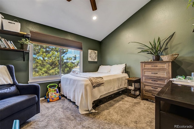 carpeted bedroom with a ceiling fan and lofted ceiling