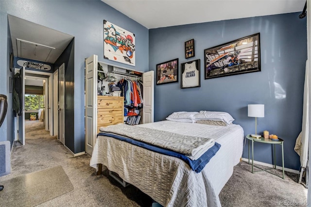 carpeted bedroom with attic access, a closet, vaulted ceiling, and baseboards