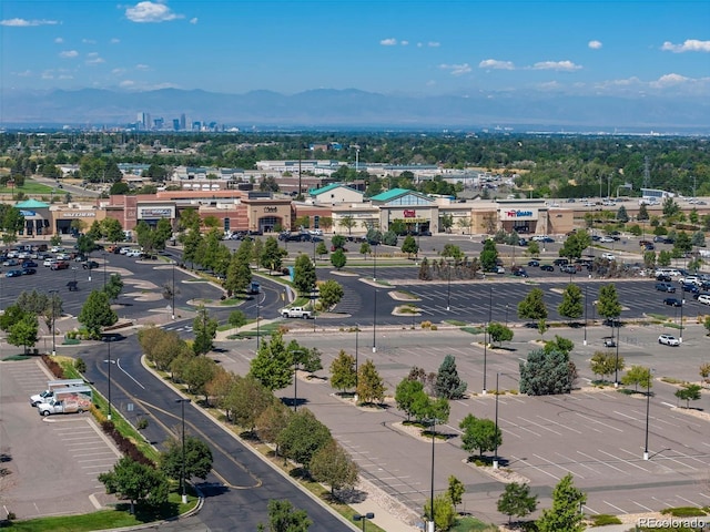 drone / aerial view featuring a view of city and a mountain view