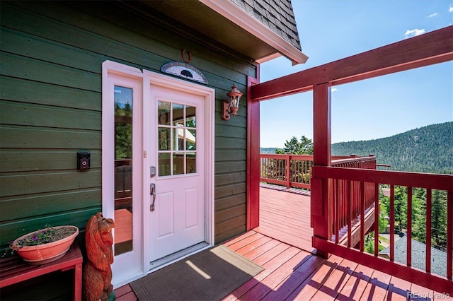 32392 Lodgepole Dr, Evergreen, CO 80439 - property entrance with a deck with mountain view