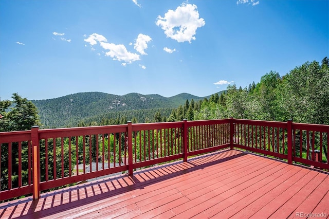 32392 Lodgepole Dr, Evergreen, CO 80439 - deck with a mountain view and a forest view