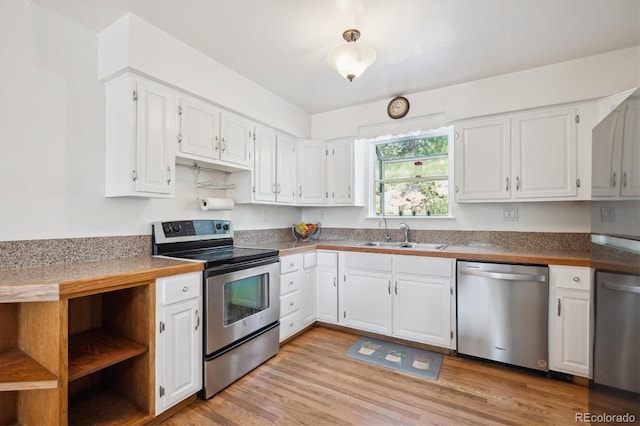 32392 Lodgepole Dr, Evergreen, CO 80439 - kitchen featuring stainless steel appliances, white cabinets, light wood-style floors, and dark countertops
