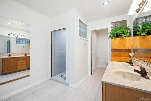 32392 Lodgepole Dr, Evergreen, CO 80439 - bathroom featuring vanity, tiled shower, and recessed lighting