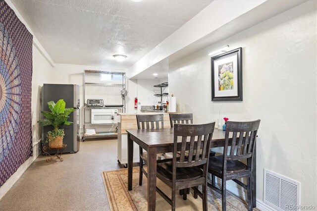 32392 Lodgepole Dr, Evergreen, CO 80439 - dining area with a textured ceiling
