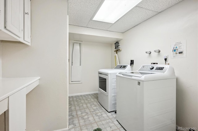 32392 Lodgepole Dr, Evergreen, CO 80439 - laundry room with washing machine and dryer, cabinet space, and light flooring