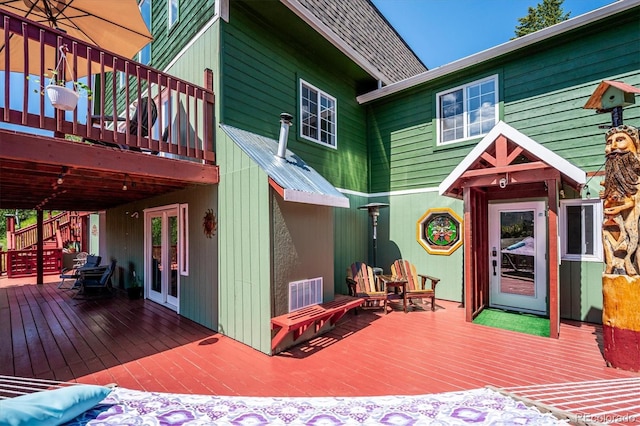 32392 Lodgepole Dr, Evergreen, CO 80439 - wooden deck featuring stairway and french doors