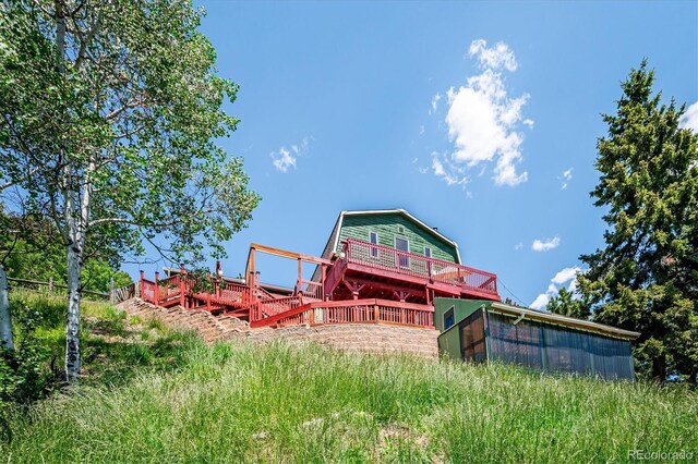 32392 Lodgepole Dr, Evergreen, CO 80439 - back of house featuring a deck