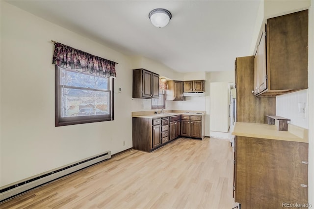 65 Yeoman Ln, Divide, CO 80814 - kitchen featuring a baseboard radiator, light wood-style floors, light countertops, and stovetop