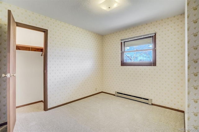 65 Yeoman Ln, Divide, CO 80814 - unfurnished bedroom featuring a baseboard heating unit, carpet floors, and a closet