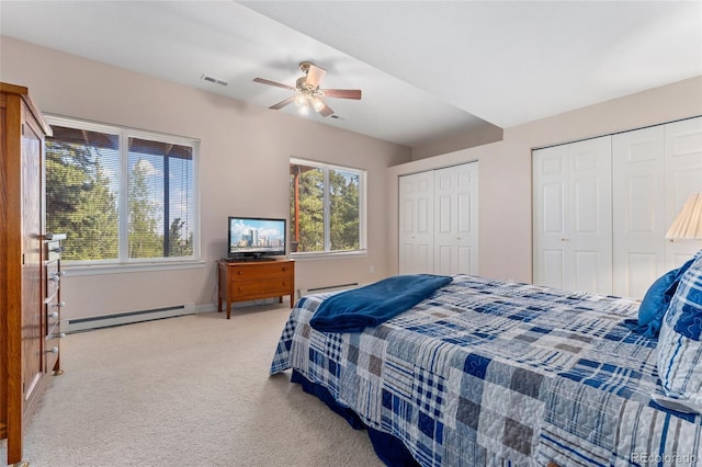 1044 Rangeview Dr, Black Hawk, CO 80422 - bedroom featuring a baseboard heating unit, two closets, light colored carpet, a baseboard radiator, and ceiling fan