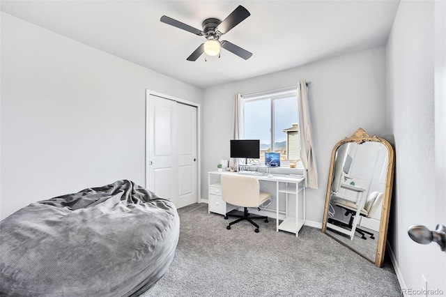 home office featuring carpet flooring, baseboards, and ceiling fan