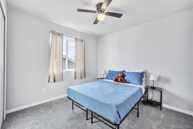 bedroom featuring ceiling fan, baseboards, and carpet