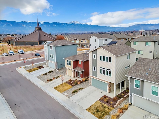 bird's eye view with a residential view and a mountain view