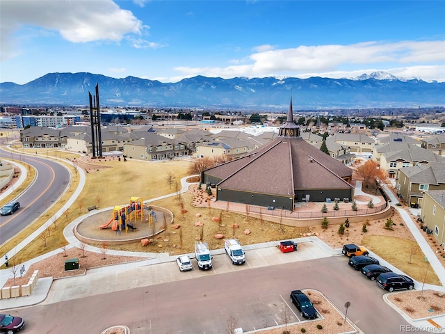 birds eye view of property featuring a mountain view and a residential view