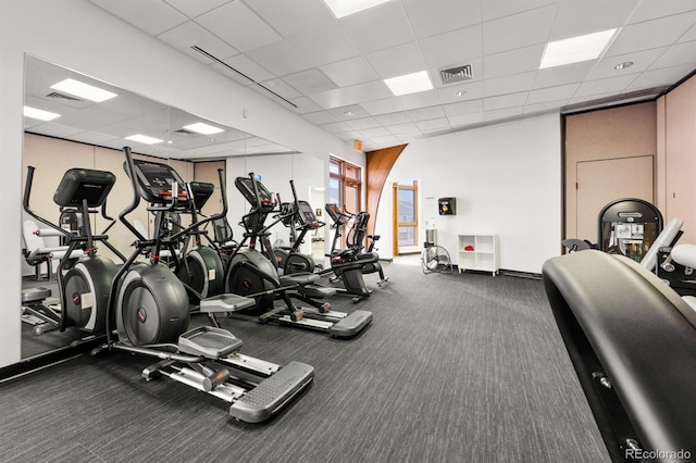 gym with a drop ceiling and visible vents