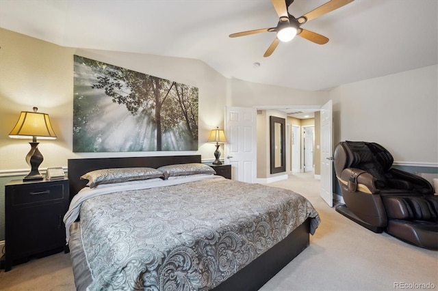 bedroom with vaulted ceiling, light carpet, and a ceiling fan