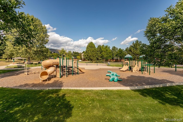 communal playground featuring a yard