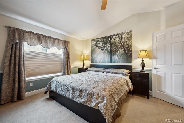 9882 S Hoyt Ct, Littleton, CO 80127 - bedroom featuring light carpet, lofted ceiling, a ceiling fan, and baseboards