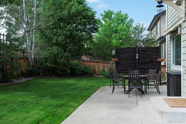 9882 S Hoyt Ct, Littleton, CO 80127 - view of yard with a patio and outdoor dining space