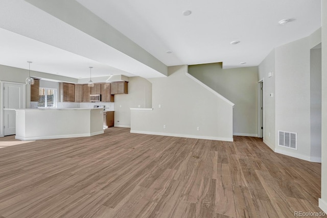 unfurnished living room with light hardwood / wood-style floors