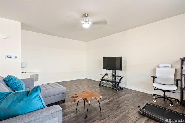 living area with ceiling fan, dark wood-type flooring, visible vents, and baseboards