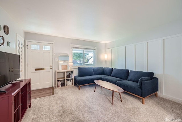 living room featuring light carpet