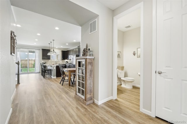 corridor featuring light hardwood / wood-style flooring