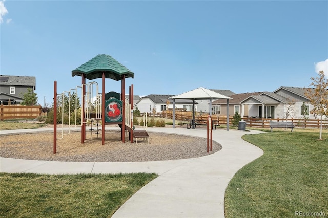 view of jungle gym featuring a lawn and central air condition unit