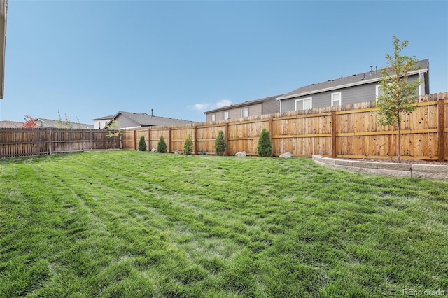 view of yard featuring a fenced backyard