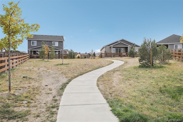 view of yard featuring a residential view and fence