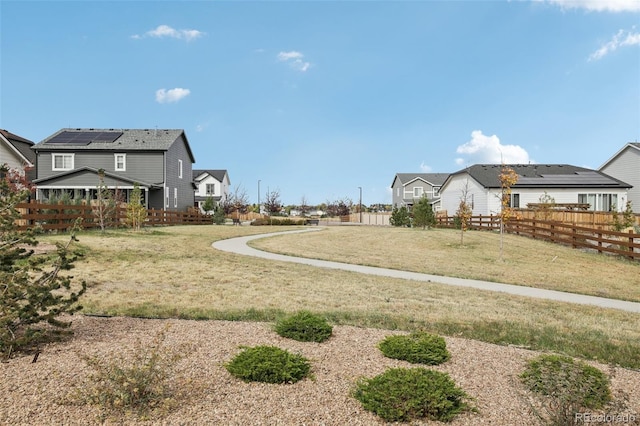 view of yard with a residential view and fence