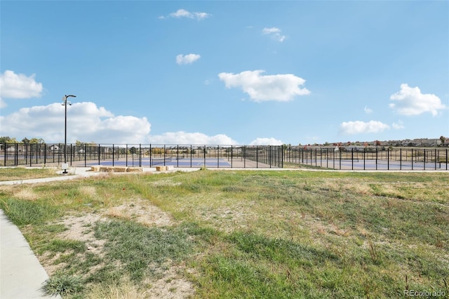 view of yard with a rural view and fence