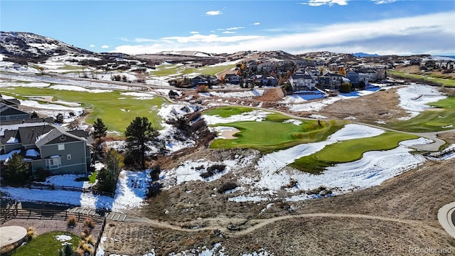 snowy aerial view featuring a mountain view