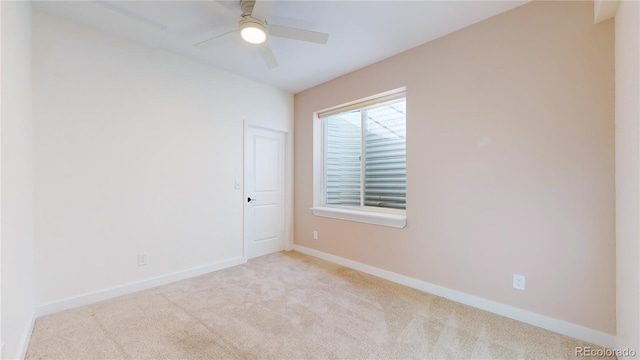 carpeted empty room with ceiling fan