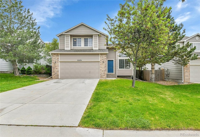 22974 E Dorado Dr, Aurora, CO 80015 - traditional-style house with a garage, brick siding, and concrete driveway