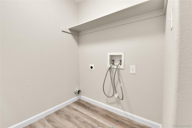 22974 E Dorado Dr, Aurora, CO 80015 - laundry room featuring hookup for a washing machine, electric dryer hookup, light wood-style flooring, and baseboards