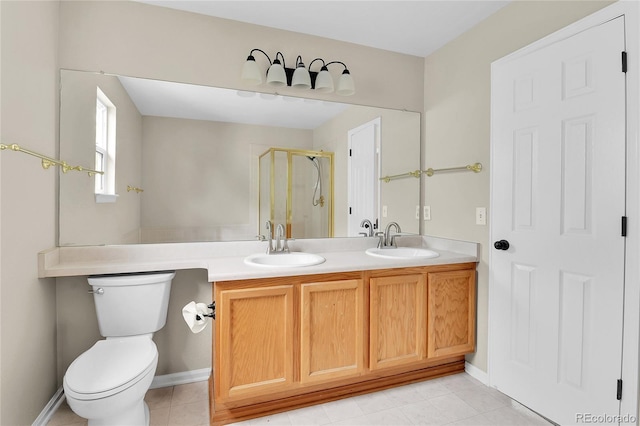 22974 E Dorado Dr, Aurora, CO 80015 - full bath featuring a shower stall, toilet, double vanity, baseboards, and tile patterned floors