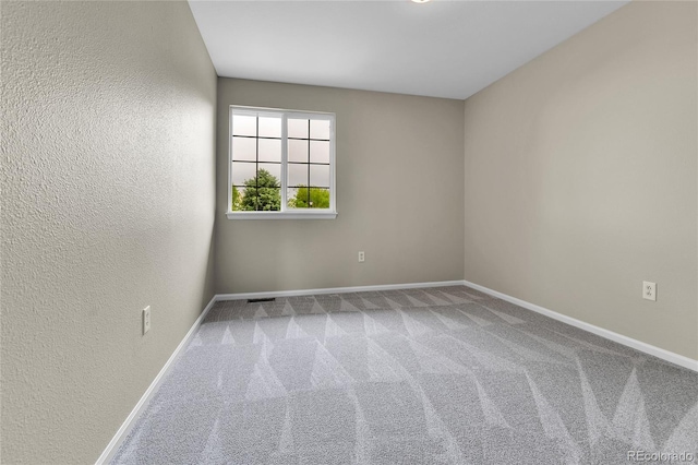 22974 E Dorado Dr, Aurora, CO 80015 - carpeted empty room with baseboards and a textured wall