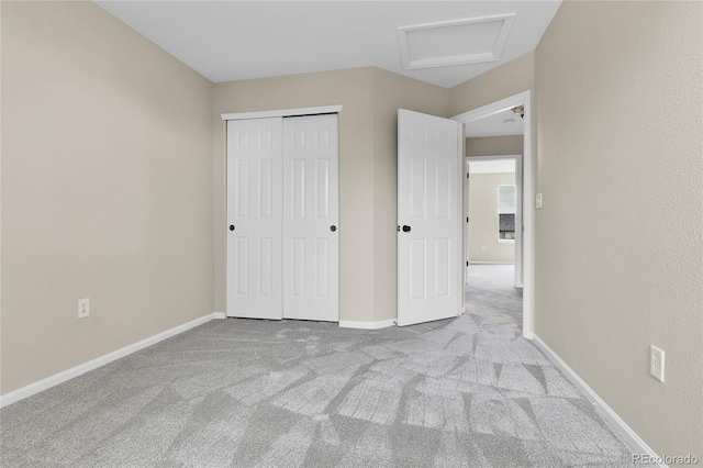 22974 E Dorado Dr, Aurora, CO 80015 - unfurnished bedroom featuring attic access, carpet floors, a closet, and baseboards
