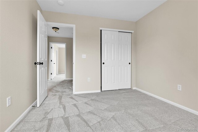 22974 E Dorado Dr, Aurora, CO 80015 - unfurnished bedroom featuring carpet flooring, baseboards, and a closet