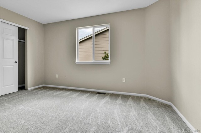 22974 E Dorado Dr, Aurora, CO 80015 - unfurnished bedroom with carpet, baseboards, and a closet
