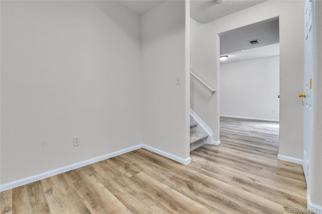 22974 E Dorado Dr, Aurora, CO 80015 - unfurnished room with wood finished floors, baseboards, and stairway
