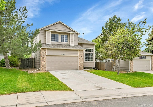 22974 E Dorado Dr, Aurora, CO 80015 - traditional-style home featuring concrete driveway, brick siding, an attached garage, and a shingled roof